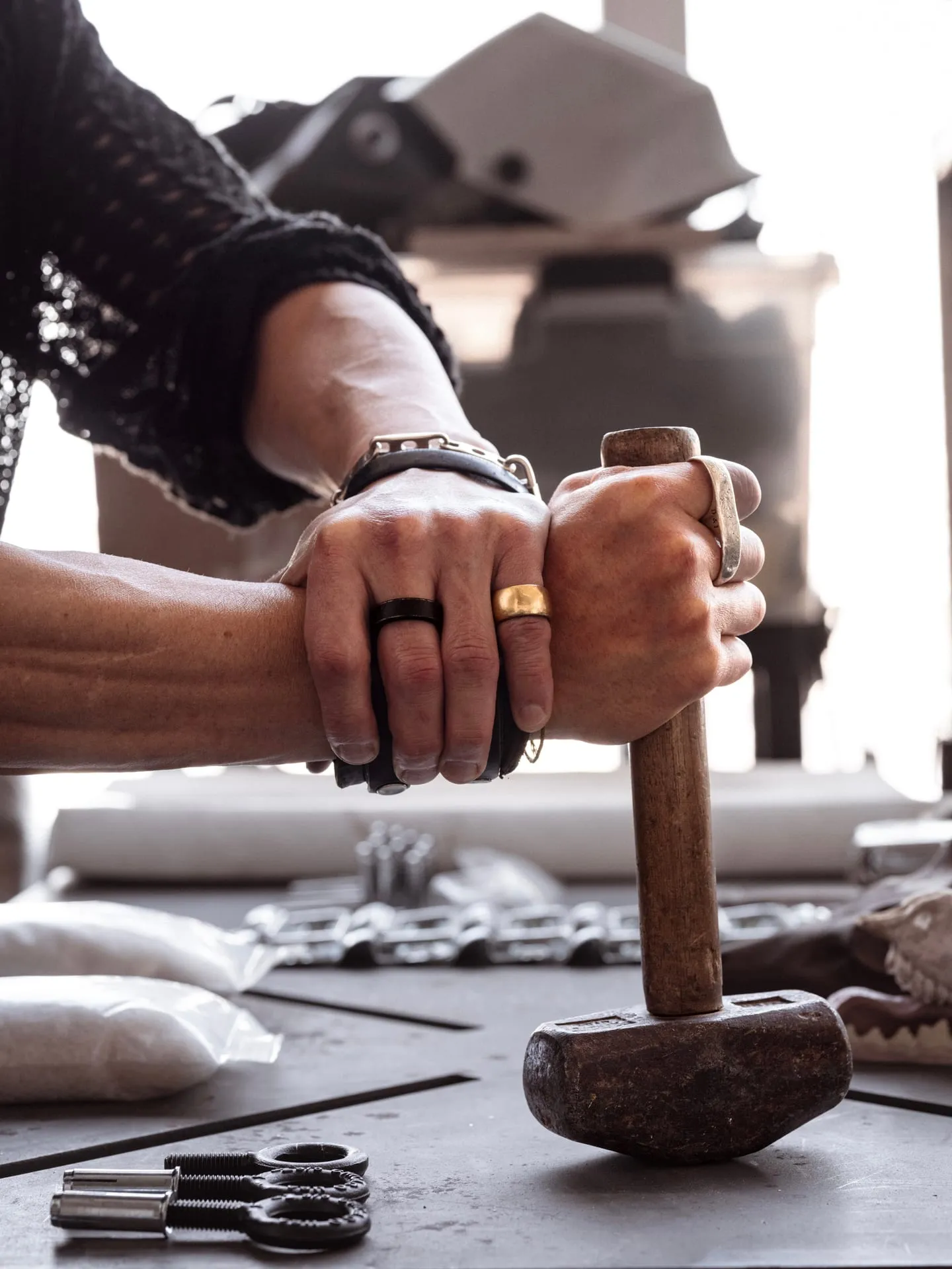 Animal skulls sit alongside screws, hammers, and raw materials in Joo's studio.