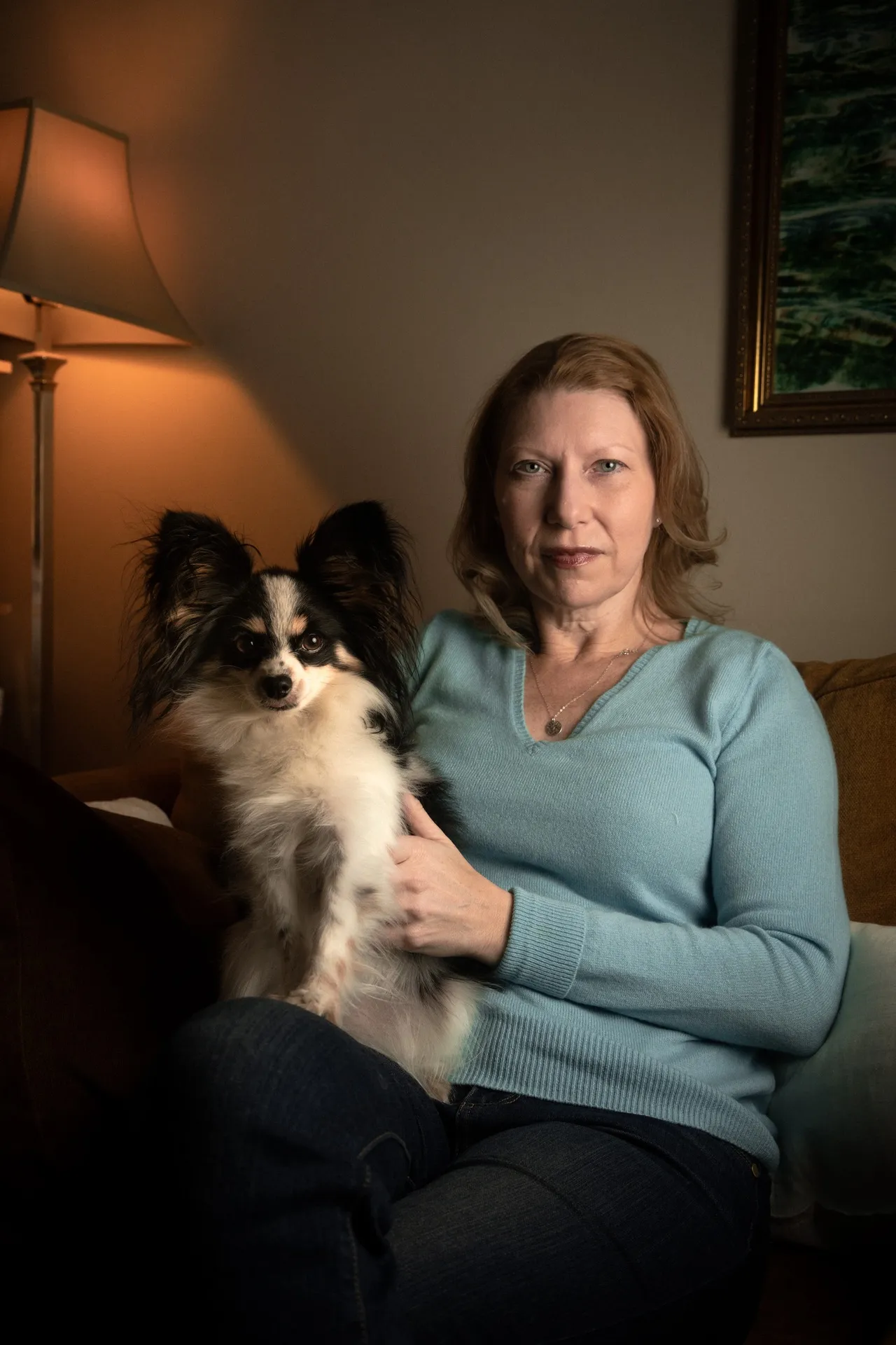 Charlotte Kullen at her apartment in The Rutherford with Sofia her service dog.