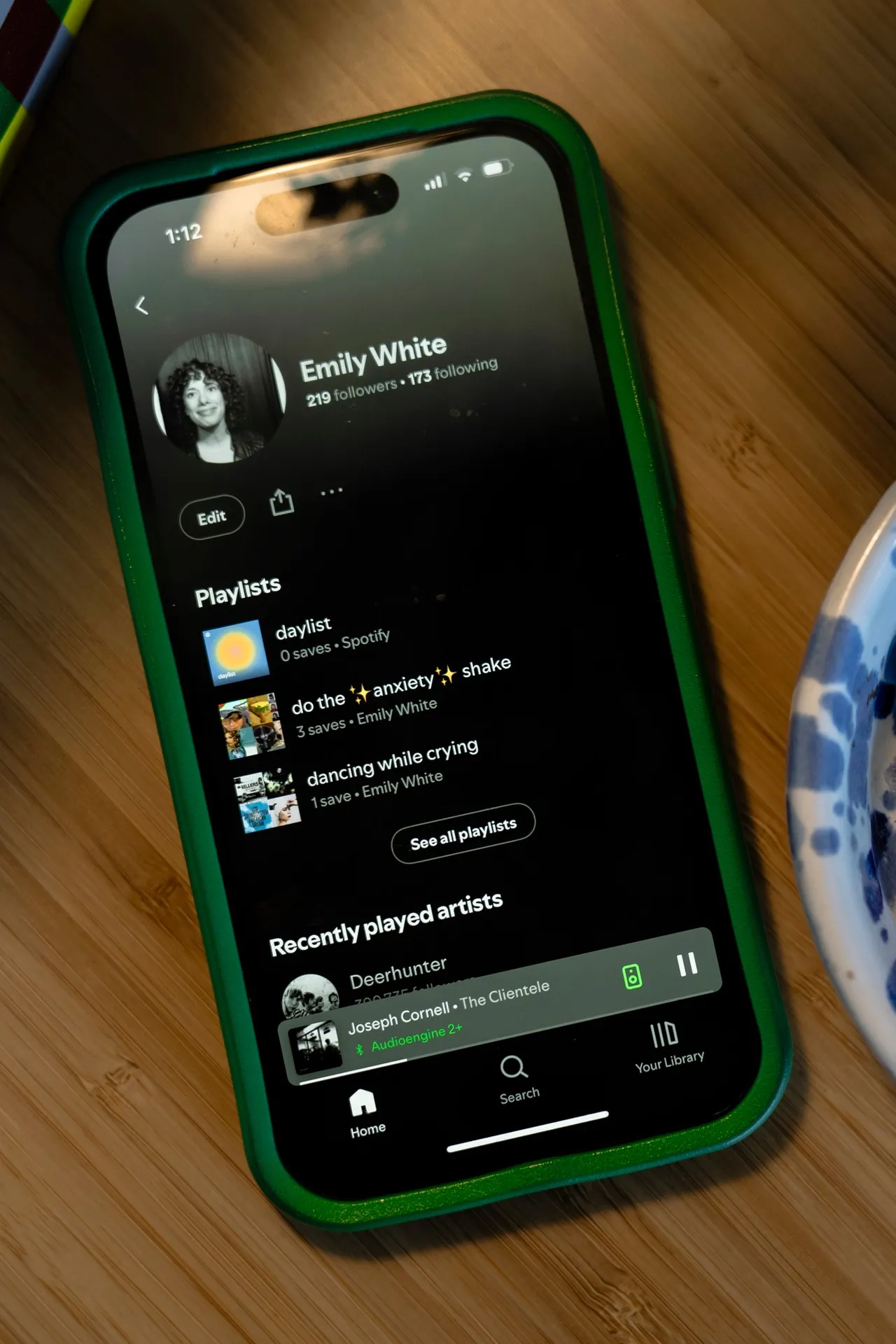 White's Spotify playlists include "Hawaiian Sunset Bops" and "sitting at this party, wondering if anyone knows me".